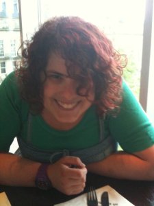 Photo of Beth sitting at a table