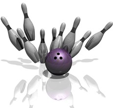 Bowling ball and pins being knocked down