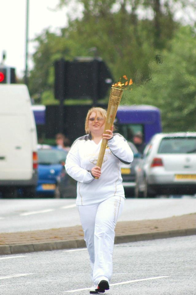 Claire carrying the Olympic Torch