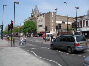 Pedestrian crossing with former cinema in the background