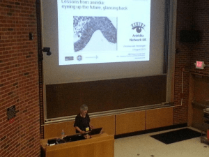 The slide on the big screen reads: Lessons from aniridia eyeing up the future: glancing back
