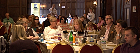 Delegates sat around a table