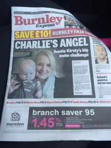 Front page of the Burnley Epxress with headline: Charlie's Angel and picture of him and his mum