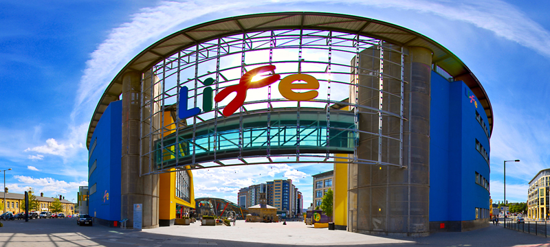 Photo of a large glass fronted entrance way with Life in large letters above.