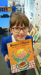 Girl holding ra reading book