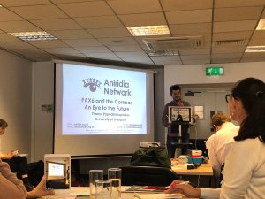 Thanos giving his presentation at the conference