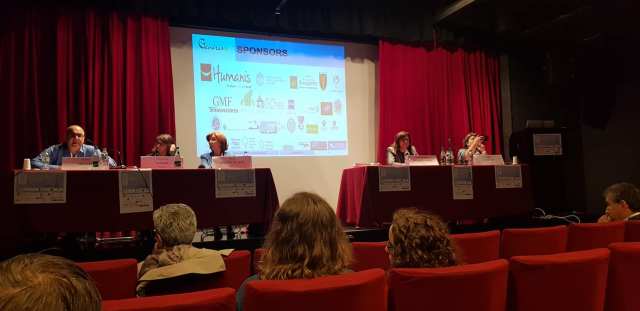 The panel of experts seated on the stage