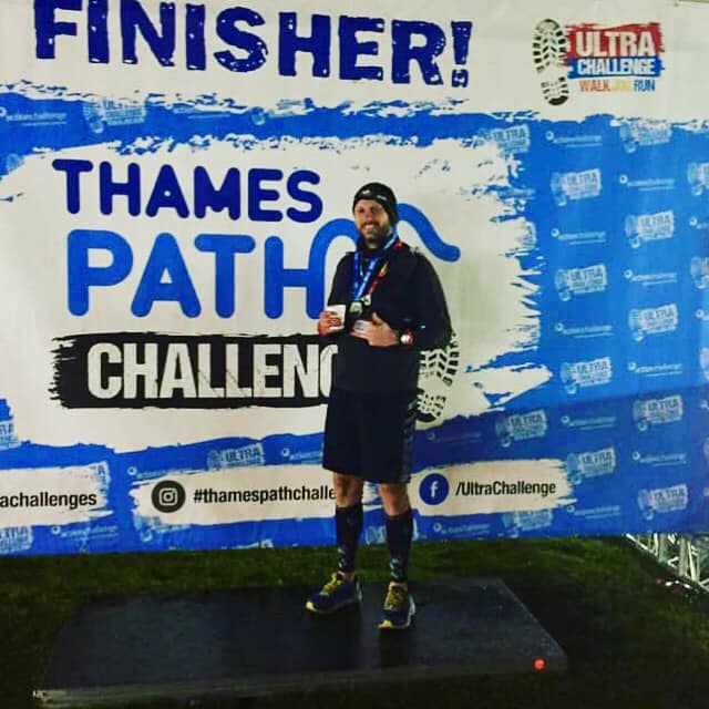 Kireon on a finishers podium wth a medal