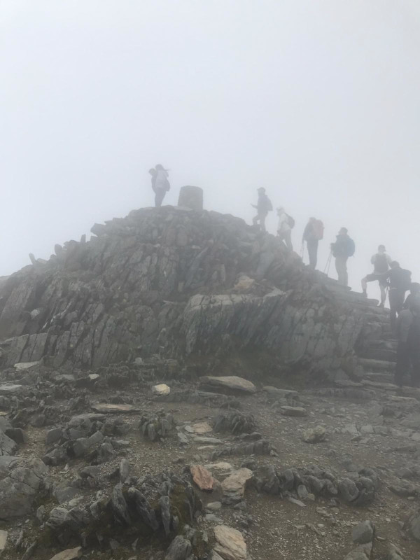 Tricia standing on the sumit of Snowdon