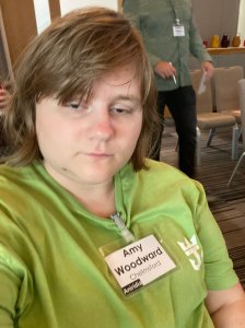 Selfie of Amy with a conference name badge