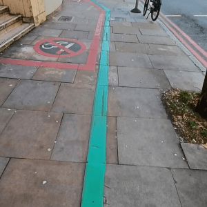 Painted green line on pavement