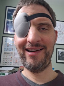 James wearing a grey eyepatch