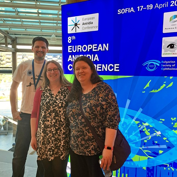 James, Nicky and Katie in front of European Aniridia Conference banner